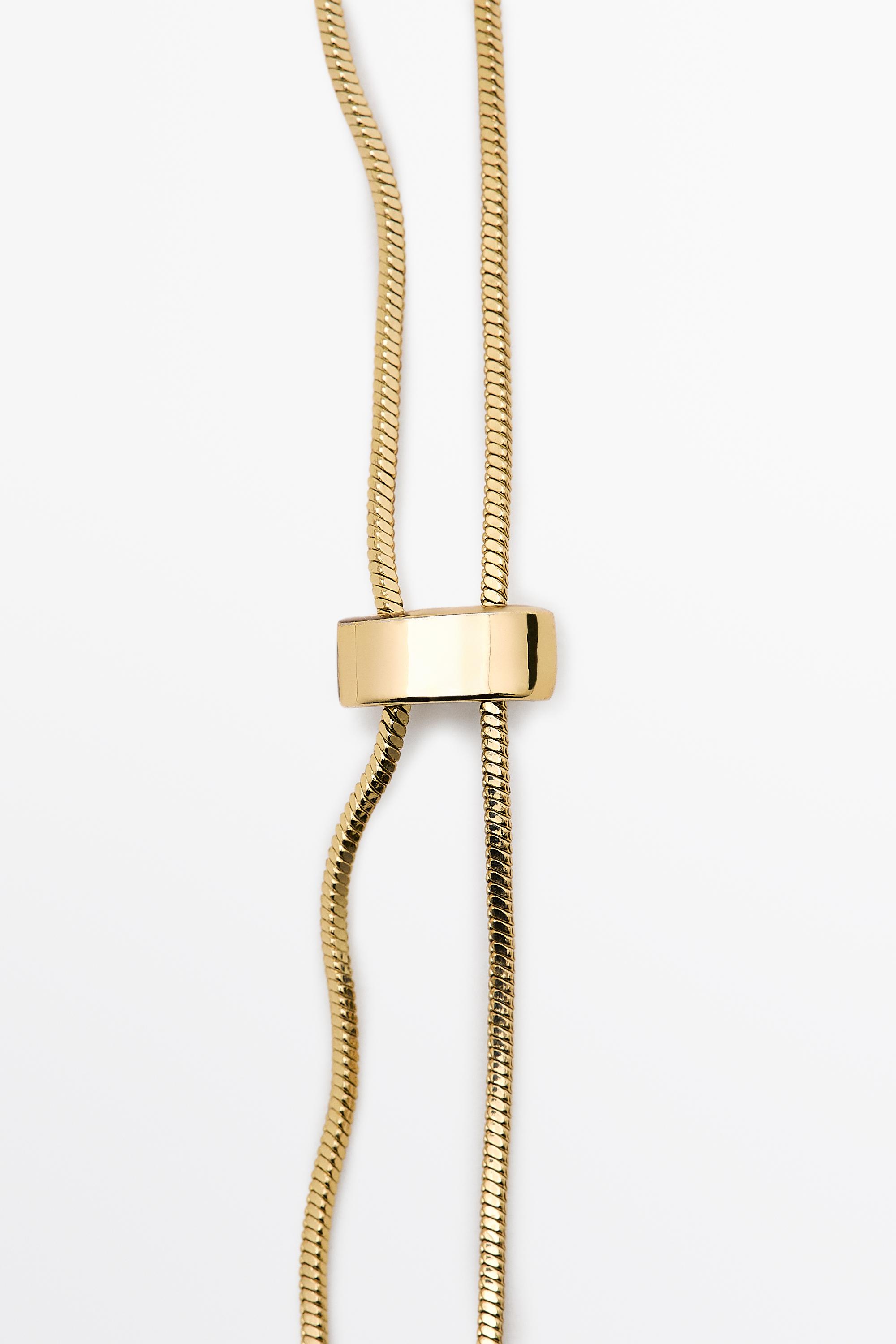 Adjustable necklace with textured pieces